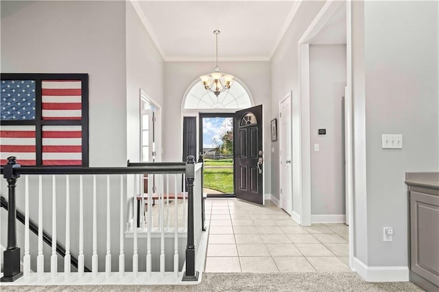 tiled foyer with an inviting chandelier and ornamental molding