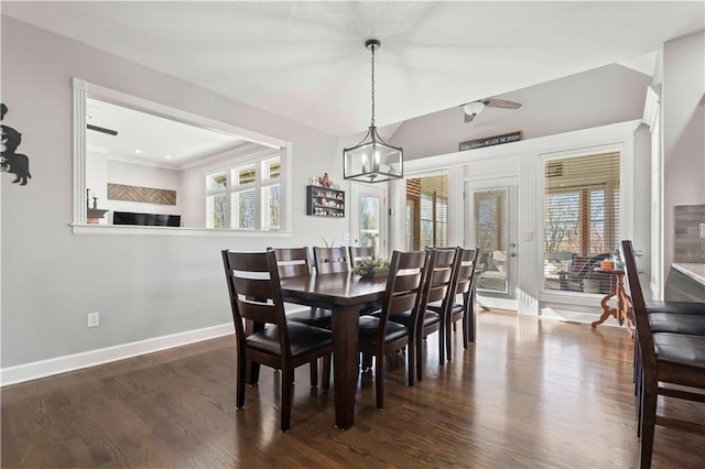 dining space with an inviting chandelier, dark hardwood / wood-style flooring, and a wealth of natural light