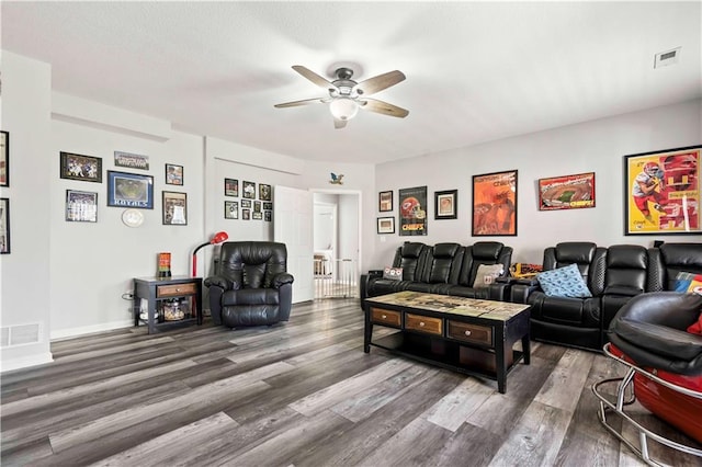 living room with ceiling fan and hardwood / wood-style floors