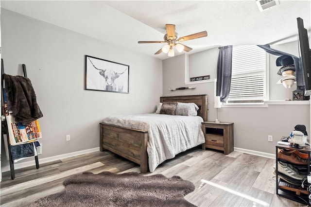 bedroom featuring light hardwood / wood-style flooring and ceiling fan