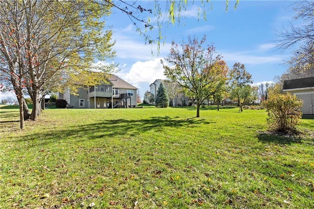 view of yard with a wooden deck