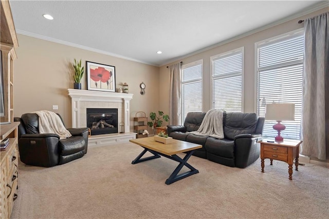 living room with a tile fireplace, ornamental molding, and light colored carpet