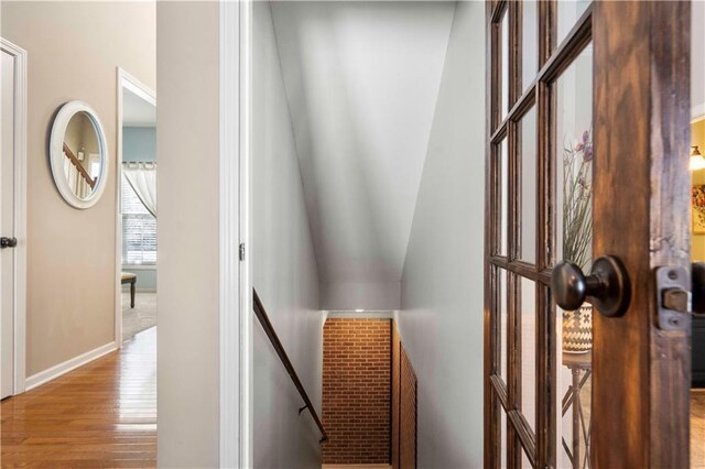 corridor with light hardwood / wood-style floors