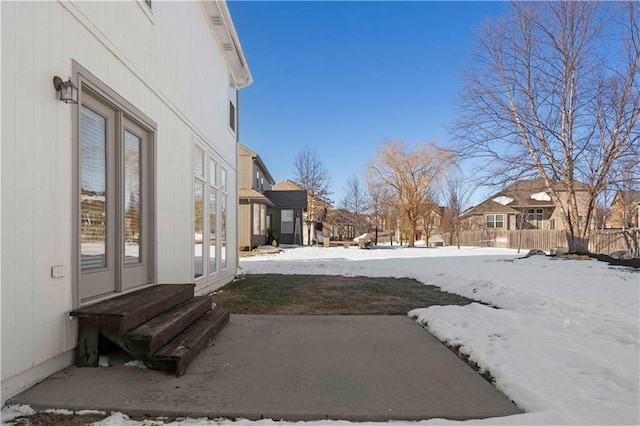 view of yard layered in snow