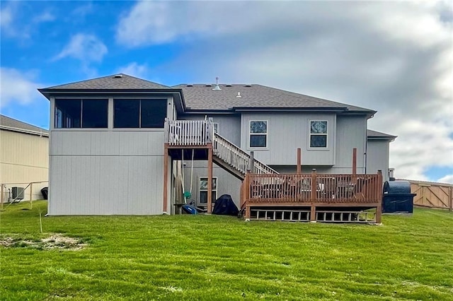 back of house with a wooden deck, central AC unit, and a yard