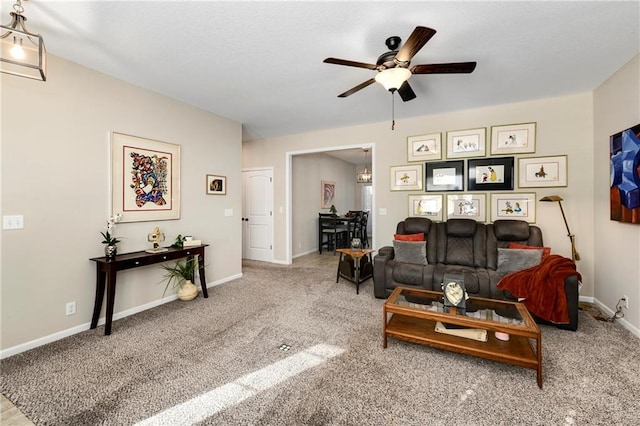 living room with carpet floors and ceiling fan