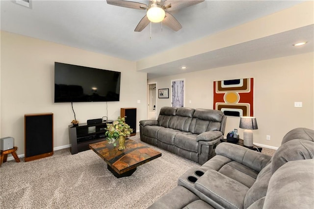 carpeted living room featuring ceiling fan