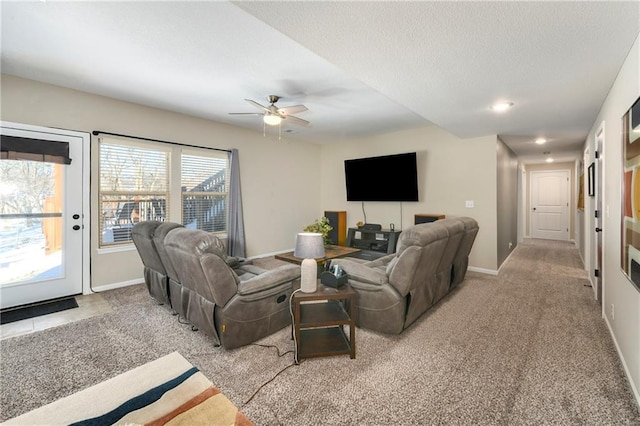 carpeted living room featuring ceiling fan