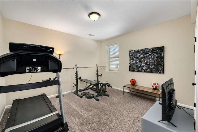 exercise room with carpet floors