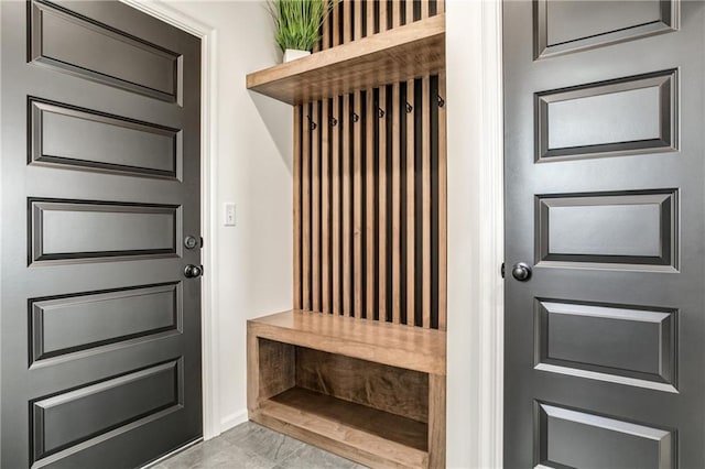 8309 NW 90th St, Kansas City, MO 64153 - mudroom with baseboards and marble look tile flooring