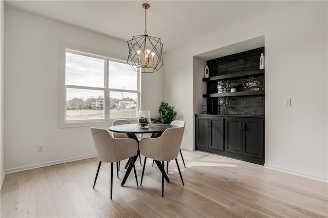 dining room featuring a chandelier and light hardwood / wood-style floors