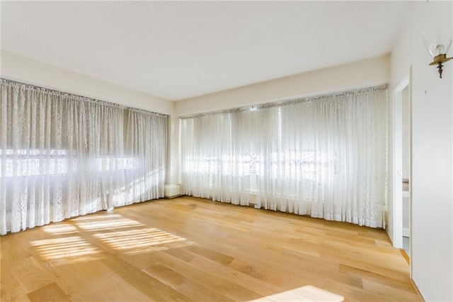 spare room featuring hardwood / wood-style flooring