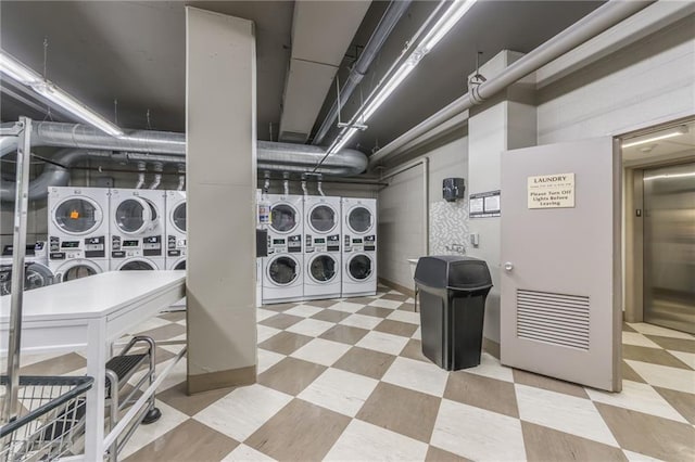 washroom featuring stacked washing maching and dryer, separate washer and dryer, and elevator