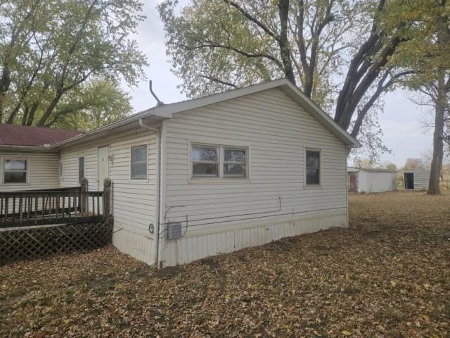 view of home's exterior featuring a deck