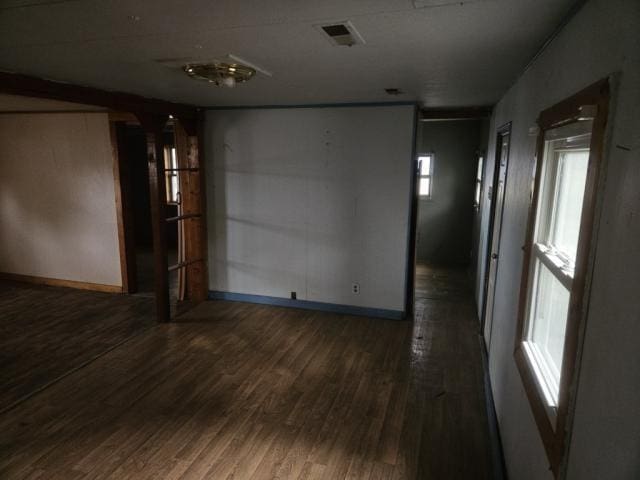 spare room with dark hardwood / wood-style floors