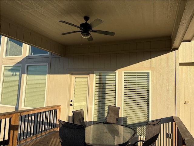 wooden terrace featuring ceiling fan