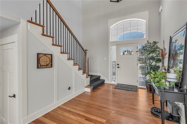 entrance foyer featuring a high ceiling and hardwood / wood-style flooring