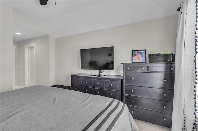 carpeted bedroom with lofted ceiling and ceiling fan