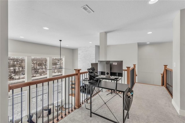 carpeted home office with a textured ceiling, visible vents, and recessed lighting