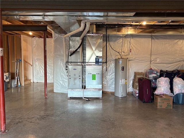 unfinished basement featuring water heater and heating unit