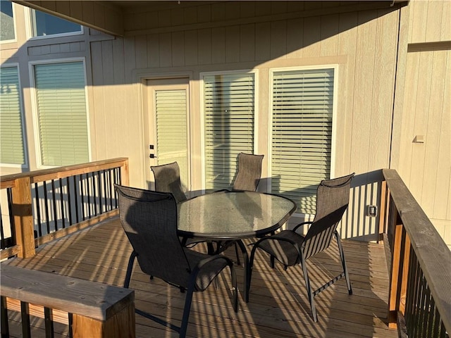 wooden deck featuring outdoor dining space