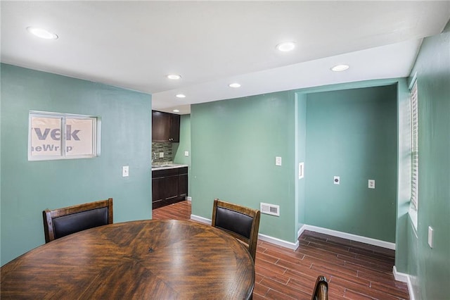 dining room featuring dark hardwood / wood-style flooring