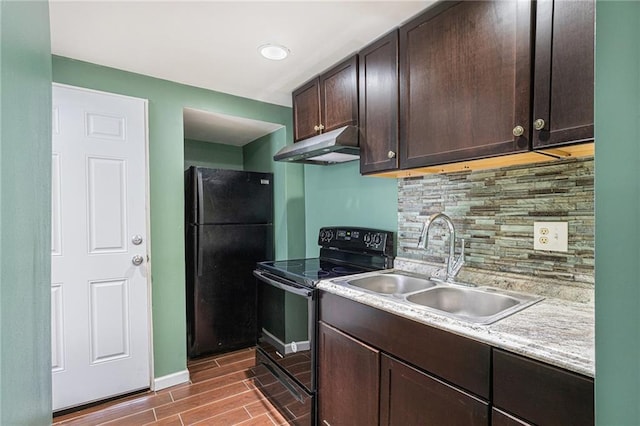 kitchen featuring tasteful backsplash, dark brown cabinetry, sink, and black appliances