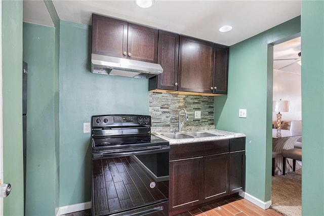 kitchen with black range with electric stovetop, sink, backsplash, and dark brown cabinetry