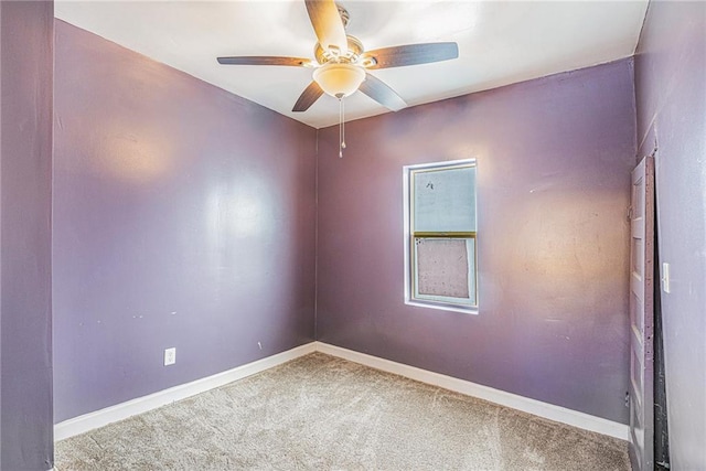 carpeted empty room with ceiling fan