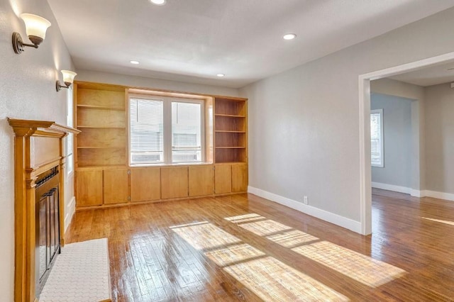 unfurnished living room with light hardwood / wood-style floors