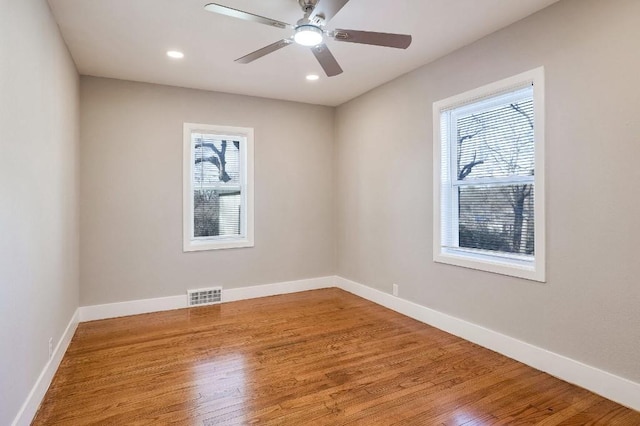 empty room featuring ceiling fan and wood-type flooring