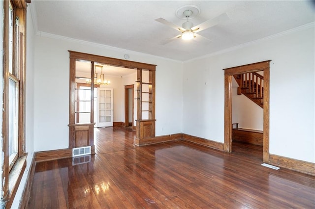 unfurnished room with french doors, ceiling fan with notable chandelier, dark hardwood / wood-style floors, and crown molding