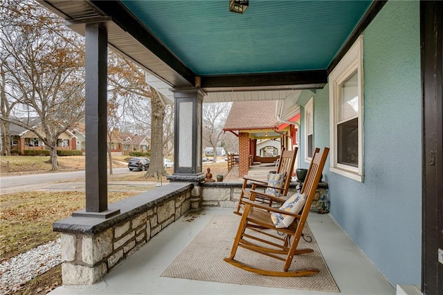 view of patio featuring a porch