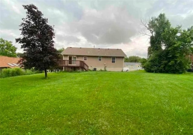 view of yard with a wooden deck