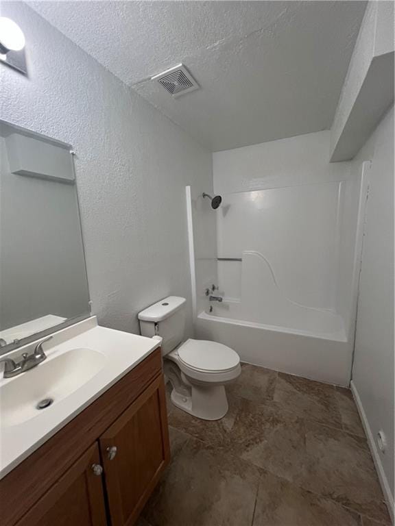 full bathroom with vanity, toilet, a textured ceiling, and shower / washtub combination