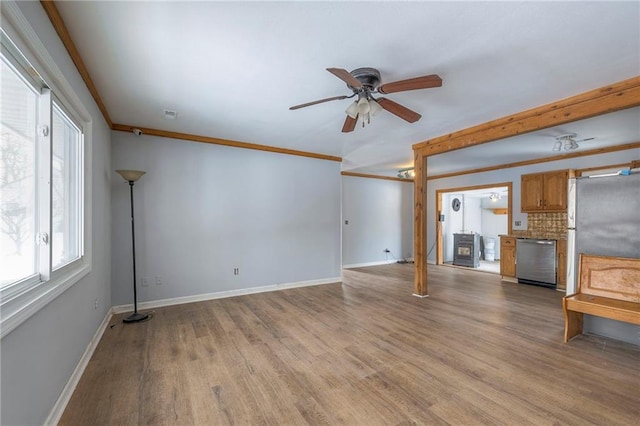 unfurnished living room with light hardwood / wood-style flooring, ceiling fan, and crown molding