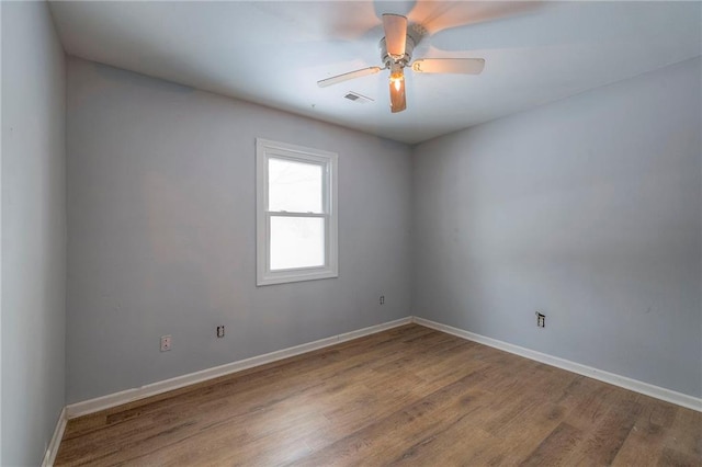 empty room featuring ceiling fan and wood-type flooring