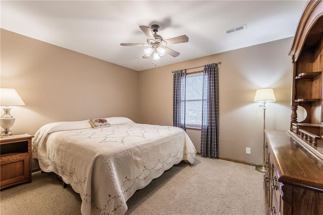 bedroom featuring ceiling fan and light colored carpet