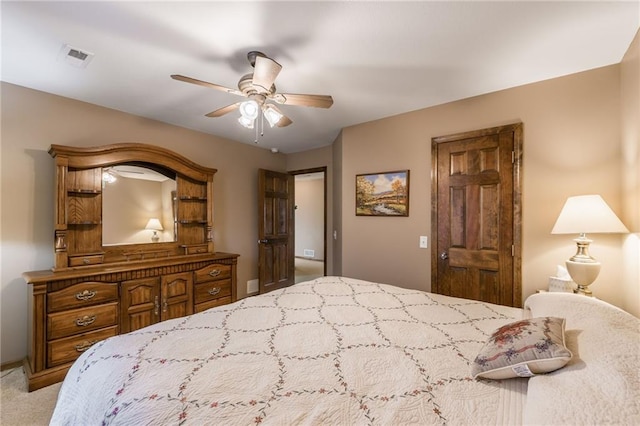 bedroom featuring ceiling fan and light carpet