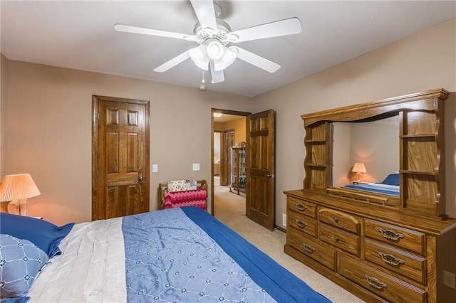 bedroom featuring ceiling fan and light colored carpet