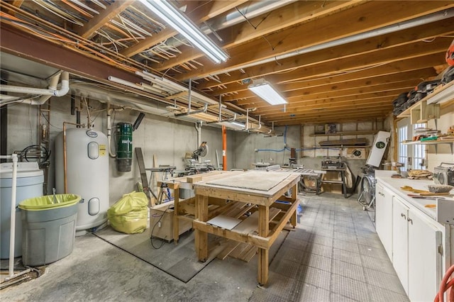 basement featuring a workshop area and water heater