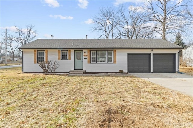 ranch-style house featuring a front lawn and a garage