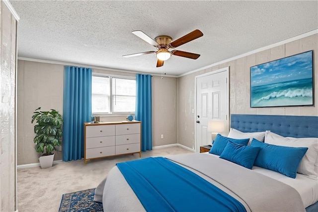 bedroom featuring ceiling fan, crown molding, light colored carpet, and a textured ceiling