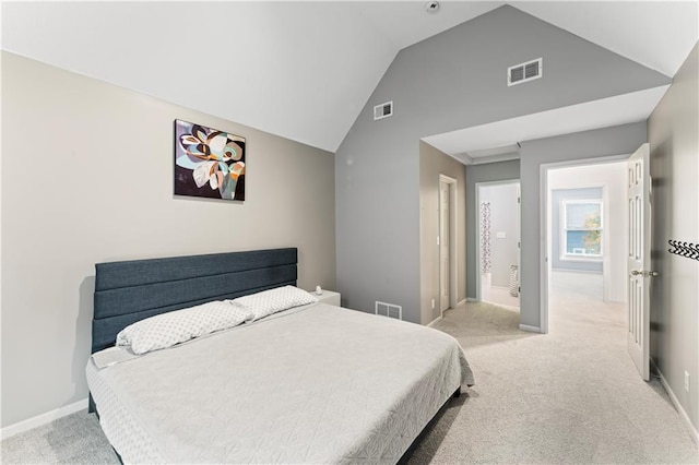 carpeted bedroom featuring vaulted ceiling