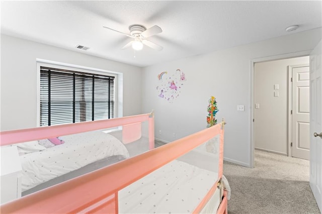 bedroom with ceiling fan and light colored carpet