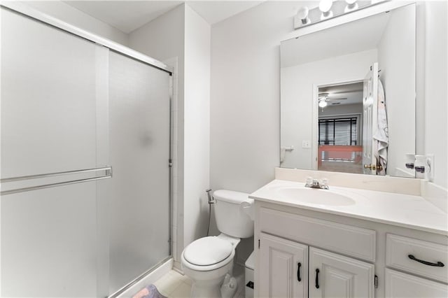 bathroom featuring ceiling fan, toilet, an enclosed shower, and vanity