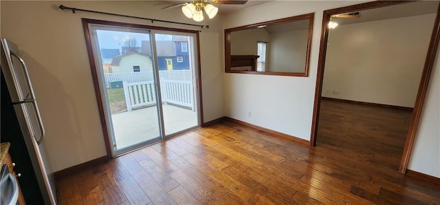 entryway featuring ceiling fan and dark wood-type flooring