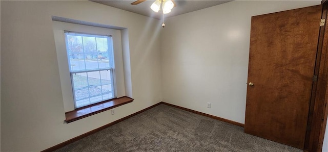 unfurnished room with ceiling fan and carpet floors