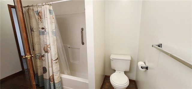 bathroom with shower / bath combination with curtain and toilet