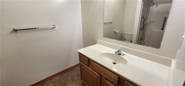 bathroom with vanity and toilet